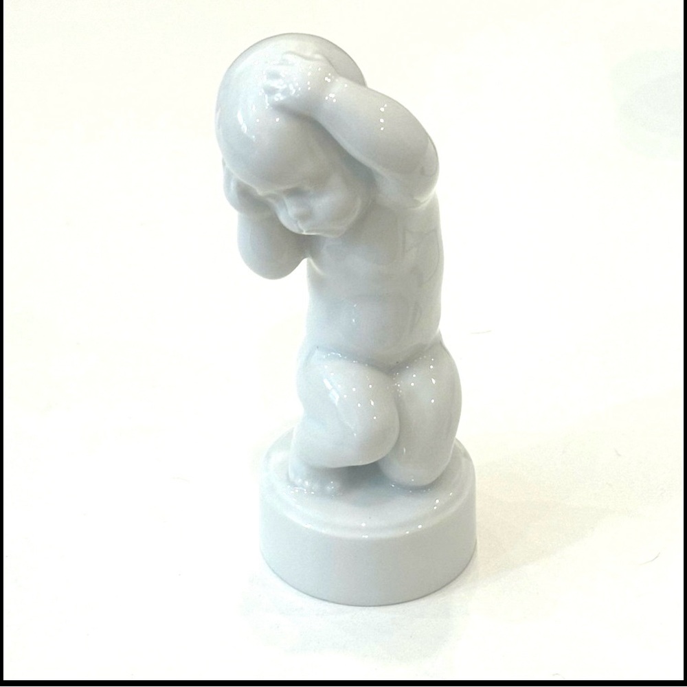 Royal Copenhagen Glossy White Headache Right Figurine